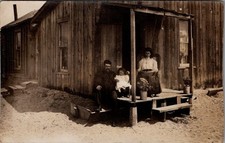 POVERTY, Family on Porch of a Small HOUSE Real Photo Postcard picture