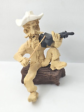 Vintage Tom Schoolcraft Signed Clay Sculpture Cowboy Playing Violin On Log picture