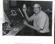 1989 Press Photo Dr. William T. Clark holds up his Biocompatible Hemoperfusion picture