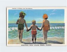 Postcard Taking A Stroll On The Beach, Greetings From Laguna Beach, Florida picture