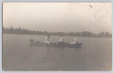 Postcard RPPC 2 Women And A Man In A Row Boat On A Calm Lake. c1915 picture