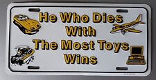 HE WHO DIES WITH THE MOST TOYS WINS  License Plate Brand New Open Box picture